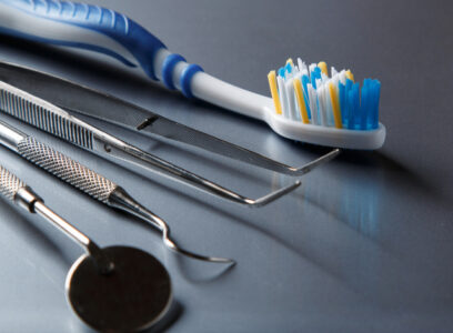 Toothbrush and dental equipment on metal surface